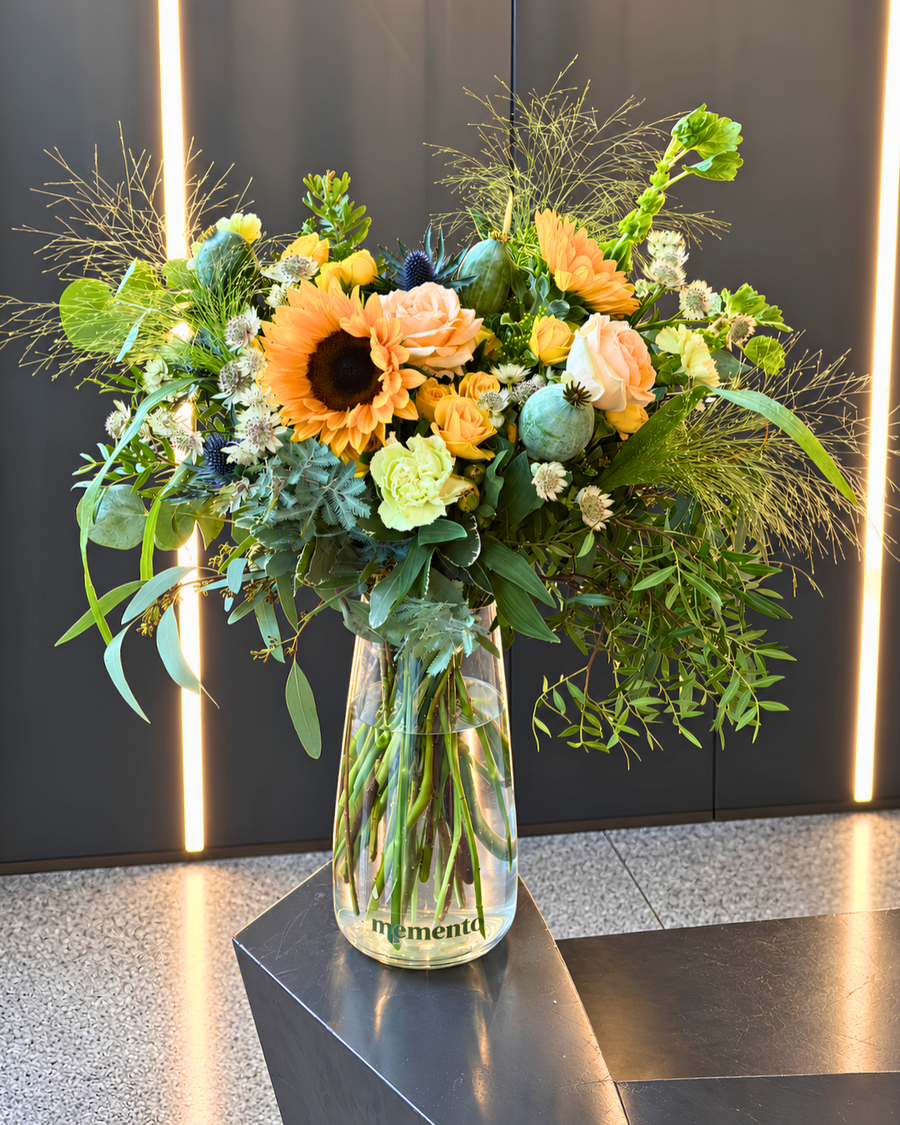 Seasonal Memento flowers arranged in a glass vase