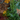 Decorative arrangement of greenery, pinecones, and dried oranges on a wooden surface.