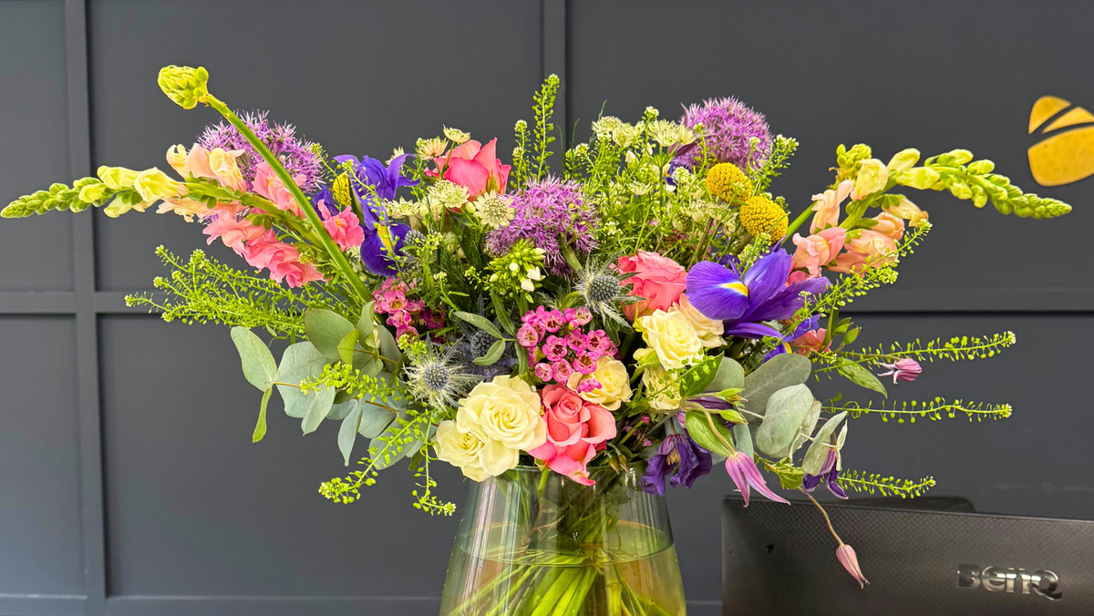 Seasonal Memento flowers arranged in a glass vase