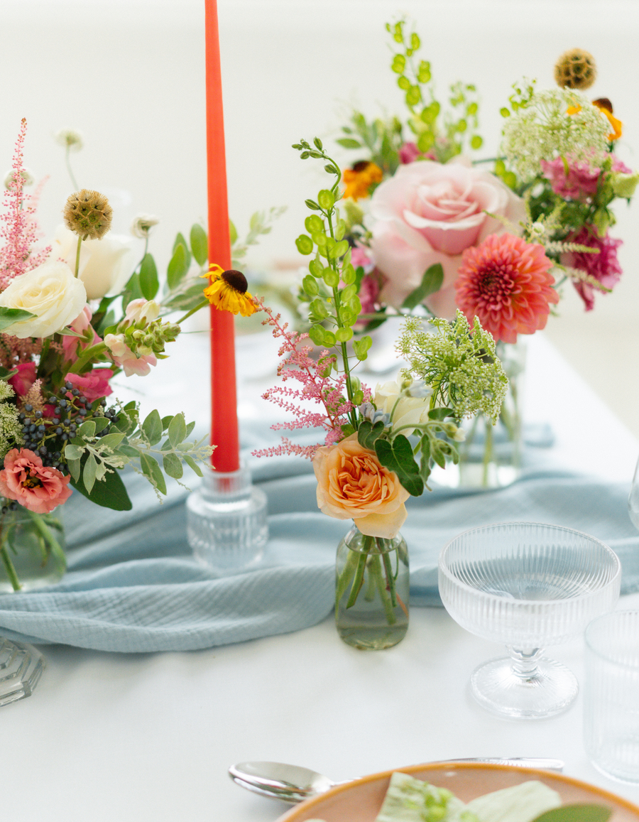Three colourful Memento event flower arrangements